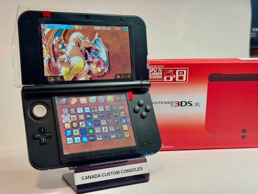 A refurbished Nintendo 3DS XL — Red/Black | Fully Modded is displayed on a CANADA CUSTOM CONSOLES stand with its box behind, featuring a Charizard-themed home screen—perfect for retro gaming enthusiasts.