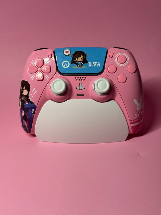 The D.Va Overwatch Custom PS5 Controller | Hall Effect Sticks | Pink features themed designs, D.Va artwork, and symbols on a pink background, offering enhanced gameplay with Hall Effect analog sticks.