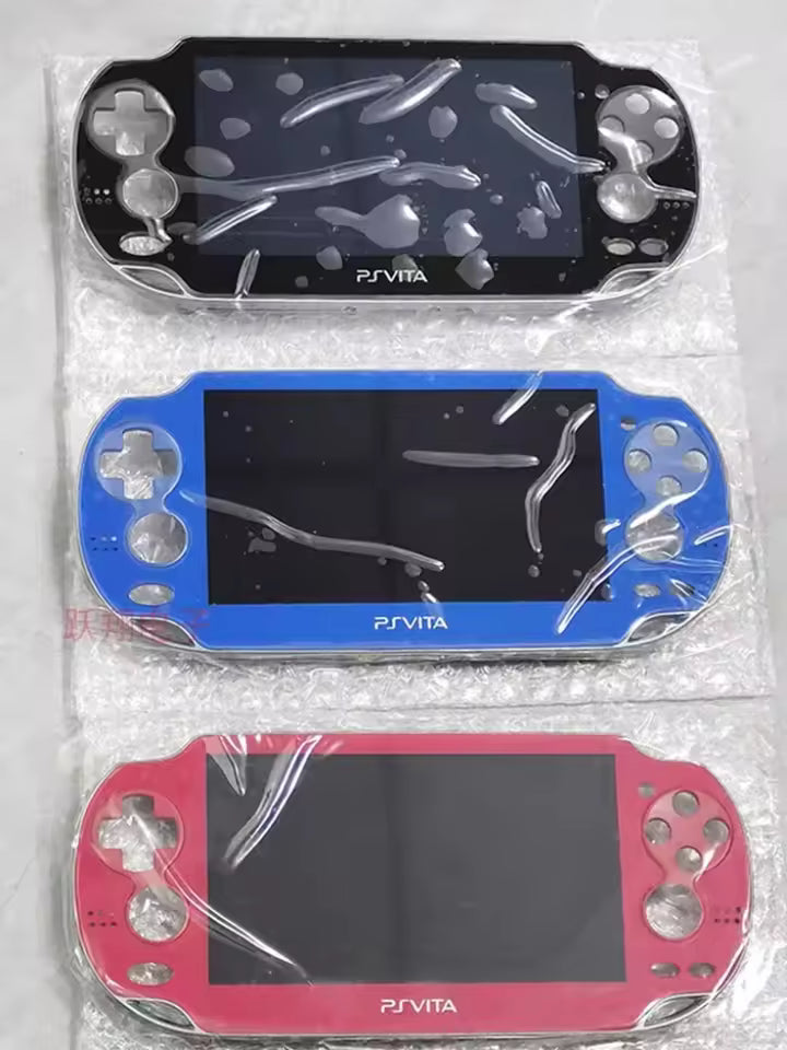 Three black, blue, and red PS Vita 1000/1001 handhelds are wrapped in plastic atop bubble wrap—perfect for those needing a PS Vita 1000 OLED Screen & Touch Digitizer Replacement.