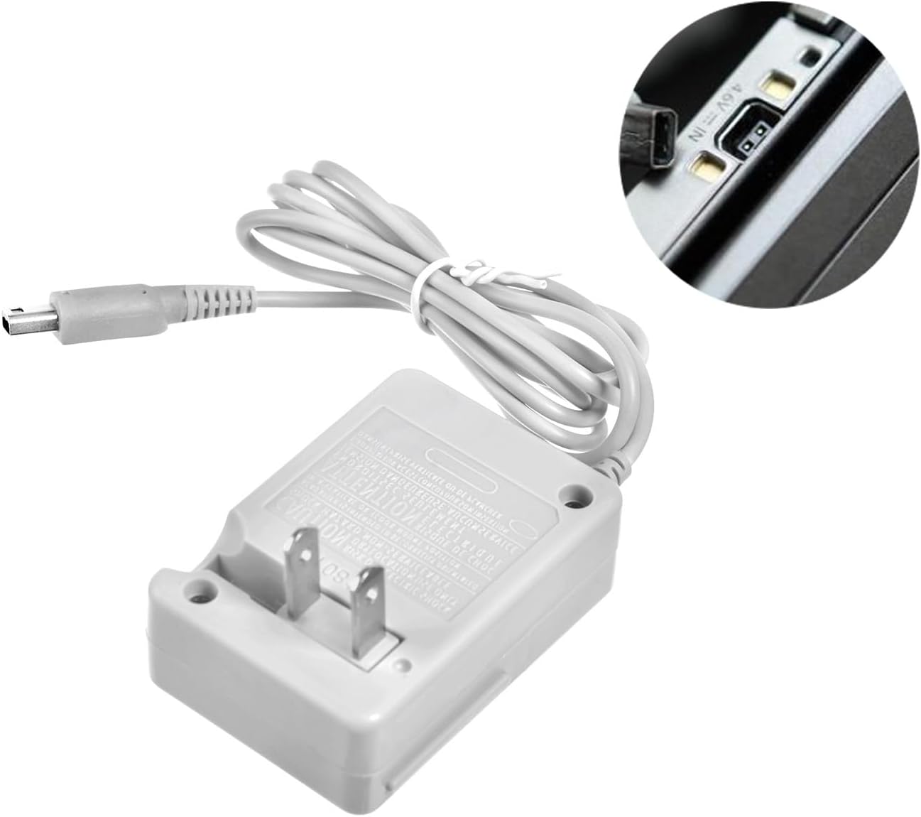 A gray Nintendo DSi / 2DS / 3DS Replacement Charger with a two-prong plug and attached cable; the inset shows it plugged into a device’s charging port. Compatible with DSi, 2DS, 3DS, and more.