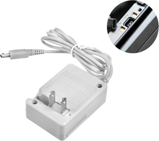 A gray Nintendo DSi / 2DS / 3DS Replacement Charger with a two-prong plug and attached cable; the inset shows it plugged into a device’s charging port. Compatible with DSi, 2DS, 3DS, and more.