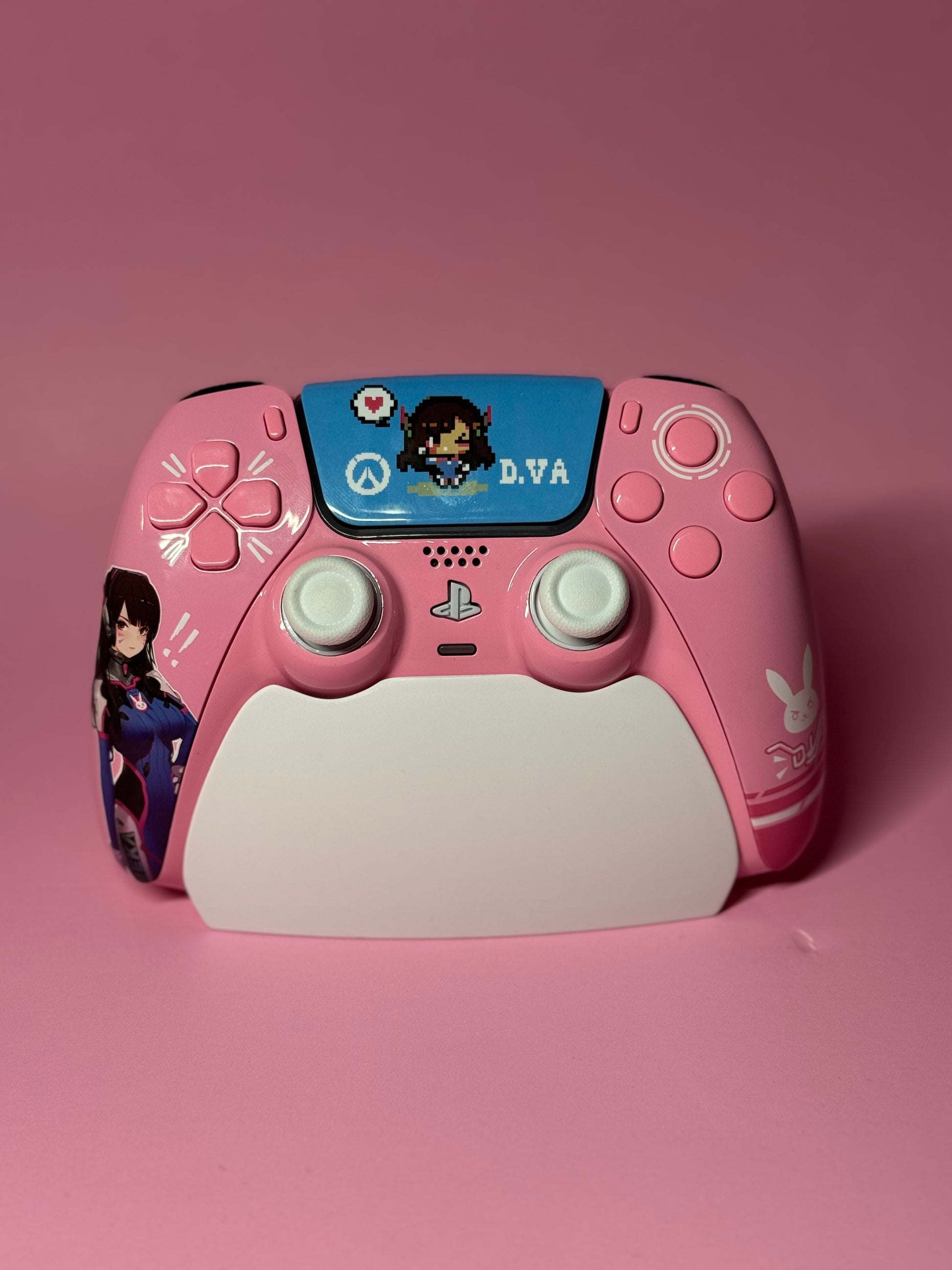 The D.Va Overwatch Custom PS5 Controller | Hall Effect Sticks | Pink features unique pink and white Overwatch-themed art with pixel D.Va designs—ideal for fans seeking a standout custom controller.