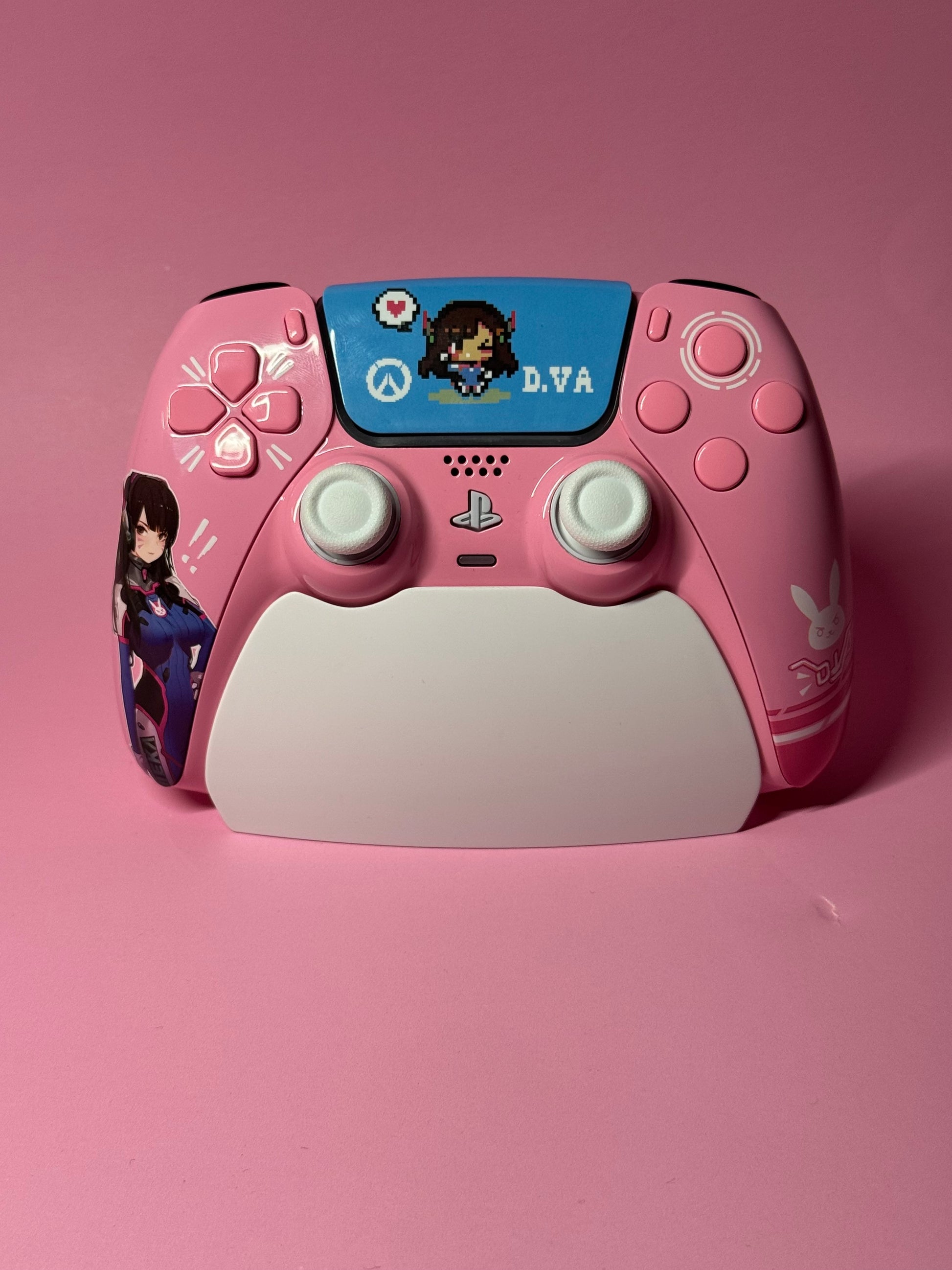 The D.Va Overwatch Custom PS5 Controller | Hall Effect Sticks | Pink features themed designs, D.Va artwork, and symbols on a pink background, offering enhanced gameplay with Hall Effect analog sticks.