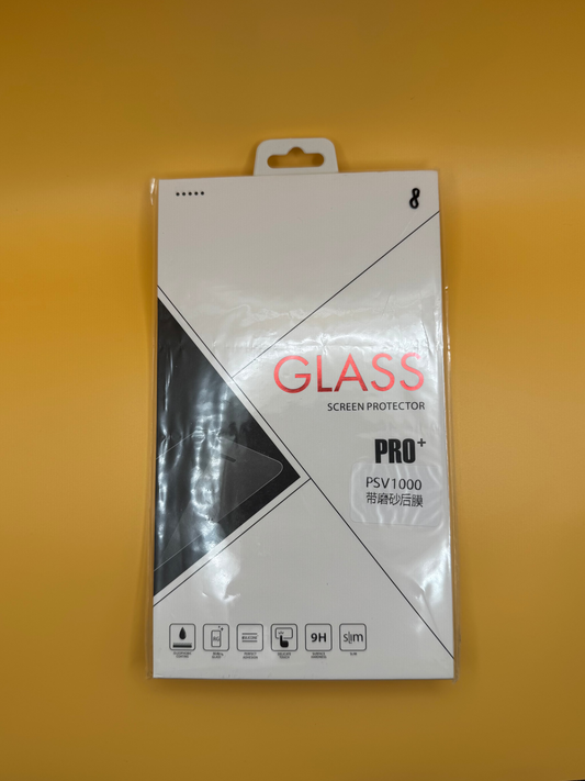 A white retail box labeled "PS Vita 1000 Tempered Glass Screen Protector | OLED Display Protection" with durability and slim icons rests on a yellow surface. It shields the PS Vita 1000 OLED screen, features Chinese text, and offers tempered glass protection.